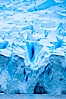 A glacier fractures and cracks, as the leading of a glacier fractures and cracks as it reaches the ocean.  The pieces will float away to become icebergs. Neko Harbor, Antarctic Peninsula, Antarctica. Image #25654