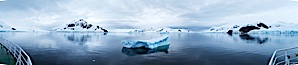 Iceberg and mountain panorama, cloudy morning. Paradise Bay, Antarctic Peninsula, Antarctica. Image #26311