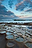Waves wash over sandstone reef, clouds and sky. La Jolla, California, USA. Image #26337