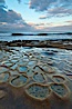 Waves wash over sandstone reef, clouds and sky. La Jolla, California, USA. Image #26342