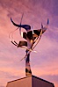 Flama de la Amistad, a statue by Leonardo Nierman.  Installed in the San Diego Convention Center�s outdoor amphitheater, Flame of Friendship is a polished, stainless-steel statue set against San Diego Bay weighing 3,700 pounds and standing 20 feet tall and eight feet wide. San Diego, California, USA. Image #26554