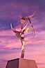 Flama de la Amistad, a statue by Leonardo Nierman.  Installed in the San Diego Convention Center�s outdoor amphitheater, Flame of Friendship is a polished, stainless-steel statue set against San Diego Bay weighing 3,700 pounds and standing 20 feet tall and eight feet wide. San Diego, California, USA. Image #26556