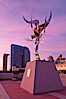 Flama de la Amistad, a statue by Leonardo Nierman.  Installed in the San Diego Convention Center�s outdoor amphitheater, Flame of Friendship is a polished, stainless-steel statue set against San Diego Bay weighing 3,700 pounds and standing 20 feet tall and eight feet wide. San Diego, California, USA. Image #26558