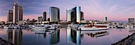 Panoramic photo of San Diego embarcadero, showing the San Diego Marriott Hotel and Marina (center), Roy's Restaurant (center) and Manchester Grand Hyatt Hotel (left) viewed from the San Diego Embacadero Marine Park. San Diego, California, USA. Image #26565
