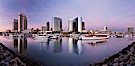 Panoramic photo of San Diego embarcadero, showing the San Diego Marriott Hotel and Marina (center), Roy's Restaurant (center) and Manchester Grand Hyatt Hotel (left) viewed from the San Diego Embarcadero Marine Park. San Diego, California, USA