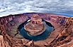 Horseshoe Bend. The Colorado River makes a 180-degree turn at Horseshoe Bend. Here the river has eroded the Navajo sandstone for eons, digging a canyon 1100-feet deep. Horseshoe Bend, Page, Arizona, USA. Image #26617