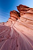 Sandstone "fins", eroded striations that depict how sandstone -- ancient compressed sand -- was laid down in layers over time.  Now exposed, the layer erode at different rates, forming delicate "fins" that stretch for long distances. Navajo Tribal Lands, Page, Arizona, USA. Image #26643