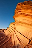 Sandstone "fins", eroded striations that depict how sandstone -- ancient compressed sand -- was laid down in layers over time.  Now exposed, the layer erode at different rates, forming delicate "fins" that stretch for long distances. Navajo Tribal Lands, Page, Arizona, USA. Image #26644