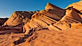 Sandstone "fins", eroded striations that depict how sandstone -- ancient compressed sand -- was laid down in layers over time.  Now exposed, the layer erode at different rates, forming delicate "fins" that stretch for long distances. Navajo Tribal Lands, Page, Arizona, USA. Image #26645