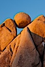 Boulders and sunset in Joshua Tree National Park.  The warm sunlight gently lights unusual boulder formations at Jumbo Rocks in Joshua Tree National Park, California. Joshua Tree National Park, California, USA. Image #26726