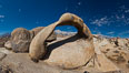Mobius Arch panorama, with Mount Whitney (the tallest peak in the continental United States), Lone Pine Peak and Sierra Nevada Range framed within the arch. Mobius Arch is a 17-foot-wide natural rock arch in the scenic Alabama Hills Recreational Area near Lone Pine, California. USA. Image #26971
