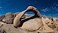 Mobius Arch panorama, with Mount Whitney (the tallest peak in the continental United States), Lone Pine Peak and Sierra Nevada Range framed within the arch. Mobius Arch is a 17-foot-wide natural rock arch in the scenic Alabama Hills Recreational Area near Lone Pine, California. Alabama Hills Recreational Area, California, USA. Image #26971