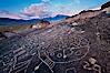 Sky Rock petroglyphs near Bishop, California.  Hidden atop an enormous boulder in the Volcanic Tablelands lies Sky Rock, a set of petroglyphs that face the sky.  These superb examples of native American petroglyph artwork are thought to be Paiute in origin, but little is known about them. Bishop, California, USA. Image #27006
