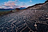 Sky Rock petroglyphs near Bishop, California.  Hidden atop an enormous boulder in the Volcanic Tablelands lies Sky Rock, a set of petroglyphs that face the sky.  These superb examples of native American petroglyph artwork are thought to be Paiute in origin, but little is known about them. Bishop, California, USA. Image #27007