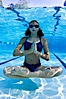 Athletic young girl underwater, performing isometric exercises. Image #27055