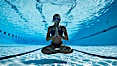 Athletic young girl underwater, performing isometric exercises. Image #27057