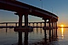 Coronado Bridge, linking San Diego to Coronado, sunrise, viewed from Coronado Island. San Diego Coronado Bridge, known locally as the Coronado Bridge, links San Diego with Coronado, California. The bridge was completed in 1969 and was a toll bridge until 2002. It is 2.1 miles long and reaches a height of 200 feet above San Diego Bay. San Diego, California, USA. Image #27101