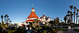 Hotel del Coronado, known affectionately as the Hotel Del. It was once the largest hotel in the world, and is one of the few remaining wooden Victorian beach resorts. It sits on the beach on Coronado Island, seen here with downtown San Diego in the distance. It is widely considered to be one of Americas most beautiful and classic hotels. Built in 1888, it was designated a National Historic Landmark in 1977. San Diego, California, USA. Image #27104