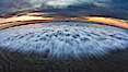 Sunset and incoming surf, gorgeous colors in the sky and on the ocean at dusk, the incoming waves are blurred in this long exposure. Carlsbad, California, USA. Image #27153