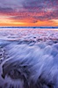 Sunset and incoming surf, gorgeous colors in the sky and on the ocean at dusk, the incoming waves are blurred in this long exposure. Carlsbad, California, USA. Image #27160