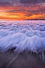 Sunset and incoming surf, gorgeous colors in the sky and on the ocean at dusk, the incoming waves are blurred in this long exposure. Carlsbad, California, USA. Image #27161