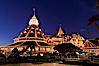 Hotel del Coronado with holiday Christmas night lights, known affectionately as the Hotel Del. It was once the largest hotel in the world, and is one of the few remaining wooden Victorian beach resorts. It sits on the beach on Coronado Island, seen here with downtown San Diego in the distance. It is widely considered to be one of Americas most beautiful and classic hotels. Built in 1888, it was designated a National Historic Landmark in 1977. San Diego, California, USA. Image #27401