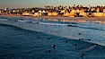 The coast of Oceanside California, waves and surfers, beach houses, just before sunset, winter, looking north. Oceanside Pier, Oceanside, California, USA. Image #27605