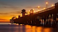 Oceanside Pier at sunset, clouds with a brilliant sky at dusk, the lights on the pier are lit. Oceanside Pier, Oceanside, California, USA. Image #27618