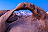 Mobius Arch at sunrise, framing snow dusted Lone Pine Peak and the Sierra Nevada Range in the background. Also known as Galen's Arch, Mobius Arch is found in the Alabama Hills Recreational Area near Lone Pine. Alabama Hills Recreational Area, California, USA. Image #27622