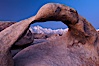 Mobius Arch at sunrise, framing snow dusted Lone Pine Peak and the Sierra Nevada Range in the background. Also known as Galen's Arch, Mobius Arch is found in the Alabama Hills Recreational Area near Lone Pine. Alabama Hills Recreational Area, California, USA. Image #27623