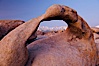 Mobius Arch at sunrise, framing snow dusted Lone Pine Peak and the Sierra Nevada Range in the background. Also known as Galen's Arch, Mobius Arch is found in the Alabama Hills Recreational Area near Lone Pine. Alabama Hills Recreational Area, California, USA. Image #27629