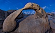 Mobius Arch at sunrise, framing snow dusted Lone Pine Peak and the Sierra Nevada Range in the background. Also known as Galen's Arch, Mobius Arch is found in the Alabama Hills Recreational Area near Lone Pine. Alabama Hills Recreational Area, California, USA. Image #27643