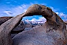 Mobius Arch at sunrise, framing snow dusted Lone Pine Peak and the Sierra Nevada Range in the background. Also known as Galen's Arch, Mobius Arch is found in the Alabama Hills Recreational Area near Lone Pine. Alabama Hills Recreational Area, California, USA. Image #27644