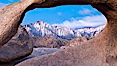 Mobius Arch at sunrise, framing snow dusted Lone Pine Peak and the Sierra Nevada Range in the background. Also known as Galen's Arch, Mobius Arch is found in the Alabama Hills Recreational Area near Lone Pine. Alabama Hills Recreational Area, California, USA. Image #27646
