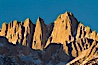 Mt. Whitney is the highest point in the contiguous United States with an elevation of 14,505 feet (4,421 m). It lies along the crest of the Sierra Nevada mountain range. Composed of the Sierra Nevada batholith granite formation, its eastern side (seen here) is quite steep. It is climbed by hundreds of hikers each year. Alabama Hills Recreational Area, California, USA. Image #27654