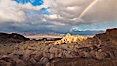 Rainbow and clearing storm clouds, sunrise light on Manly Beacon, Zabriskie Point, Death Valley National Park, California. Zabriskie Point, Death Valley National Park, California, USA. Image #27660