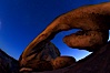 Star trails and Arch Rock. Polaris, the North Star, is at the center of the circular arc star trails as they pass above this natural stone archway in Joshua Tree National Park. Alabama Hills Recreational Area, California, USA. Image #27707