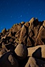 Boulders and stars, moonlight in Joshua Tree National Park. The moon gently lights unusual boulder formations at Jumbo Rocks in Joshua Tree National Park, California. Joshua Tree National Park, California, USA. Image #27717