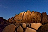 Boulders and stars, moonlight in Joshua Tree National Park. The moon gently lights unusual boulder formations at Jumbo Rocks in Joshua Tree National Park, California. Joshua Tree National Park, California, USA. Image #27718