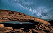 The Milky Way arching over Mesa Arch at night. Mesa Arch, Canyonlands National Park, Utah, USA. Image #27827