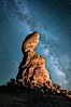 Balanced Rock and Milky Way stars at night. Balanced Rock, Arches National Park, Utah, USA. Image #27835