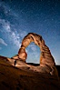 Delicate Arch and Milky Way, lit by quarter moon, hiker's flashlight and the fading blue sky one hour after sunset.  Arches National Park, Utah. Arches National Park, Utah, USA. Image #27855