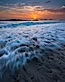 Sunset and incoming surf, gorgeous colors in the sky and on the ocean at dusk, the incoming waves are blurred in this long exposure. Carlsbad, California, USA. Image #27878