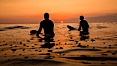 Two surfers at sunset, blood red dusk, Encinitas. Encinitas, California, USA. Image #27976