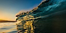 Sunrise glints yellow on breaking wave, dawn surf. The Wedge, Newport Beach, California, USA. Image #27977