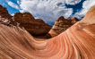 The Wave in the North Coyote Buttes, an area of fantastic eroded sandstone featuring beautiful swirls, wild colors, countless striations, and bizarre shapes set amidst the dramatic surrounding North Coyote Buttes of Arizona and Utah. The sandstone formations of the North Coyote Buttes, including the Wave, date from the Jurassic period. Managed by the Bureau of Land Management, the Wave is located in the Paria Canyon-Vermilion Cliffs Wilderness and is accessible on foot by permit only. USA. Image #28601