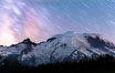 Moutain climbers light see upon Mount Rainier, Milky Way and stars at night above Mount Rainier. Sunrise, Mount Rainier National Park, Washington, USA. Image #28726