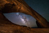 Milky Way and Stars through Wilson Arch. Wilson Arch rises high above route 191 in eastern Utah, with a span of 91 feet and a height of 46 feet. Moab, USA. Image #29275