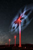 Ocotillo Wind Energy Turbines, at night with stars and the Milky Way in the sky above, the moving turbine blades illuminated by a small flashlight. California, USA. Image #30233