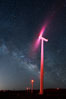 Ocotillo Wind Energy Turbines, at night with stars and the Milky Way in the sky above, the moving turbine blades illuminated by a small flashlight. California, USA. Image #30238